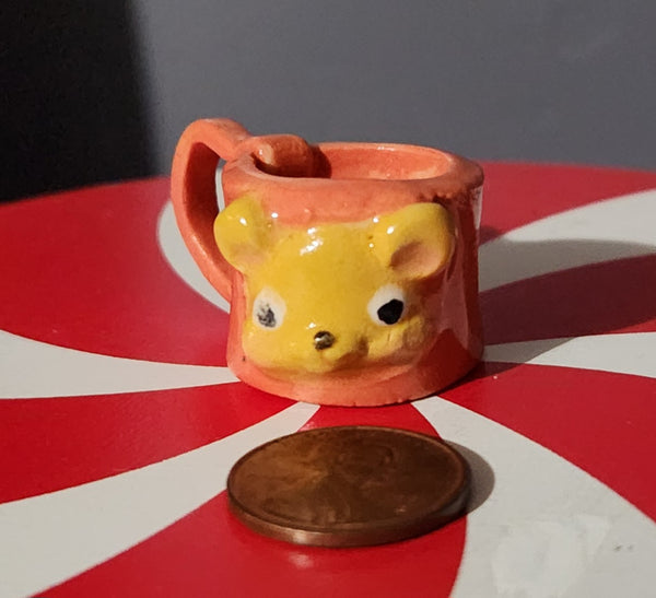 Miniature ceramic mugs, assorted animal faces