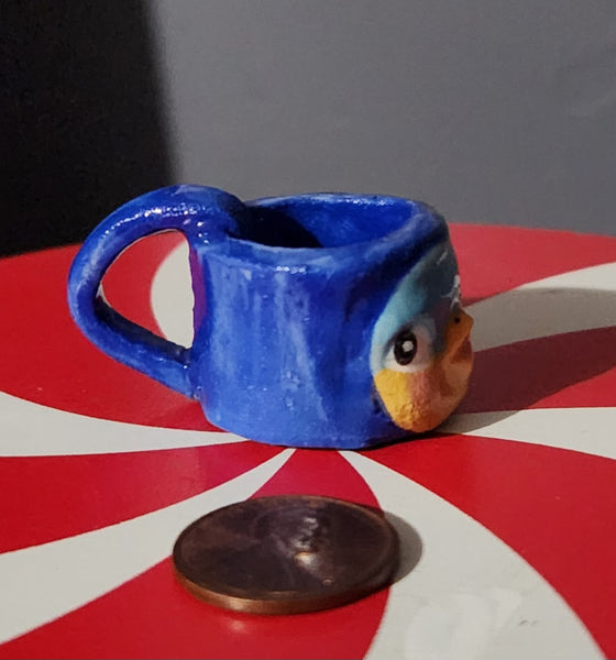 Miniature ceramic mugs, assorted animal faces