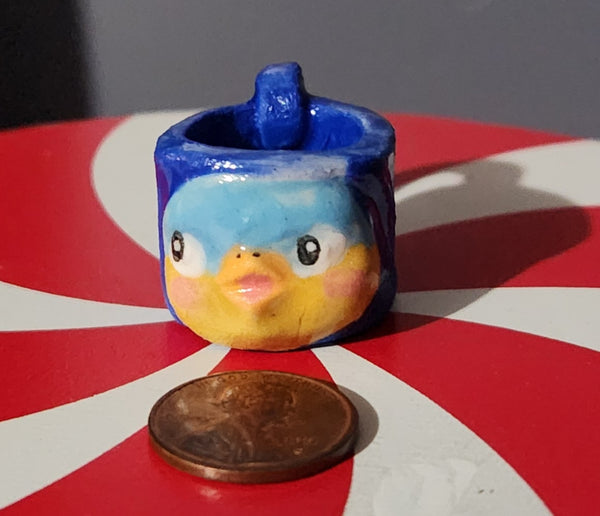 Miniature ceramic mugs, assorted animal faces