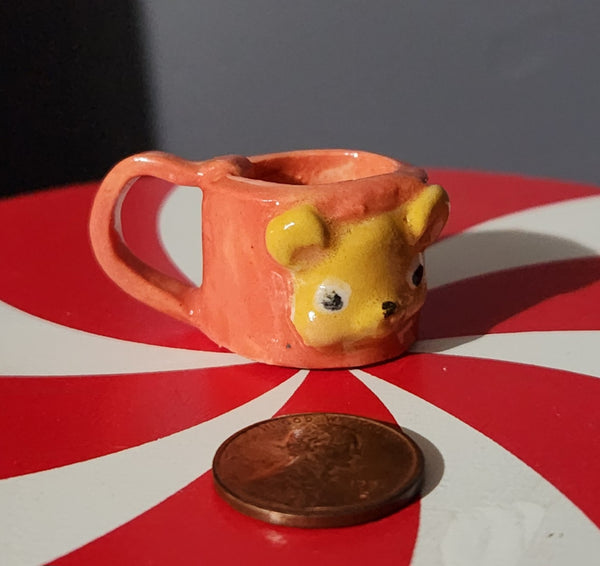 Miniature ceramic mugs, assorted animal faces