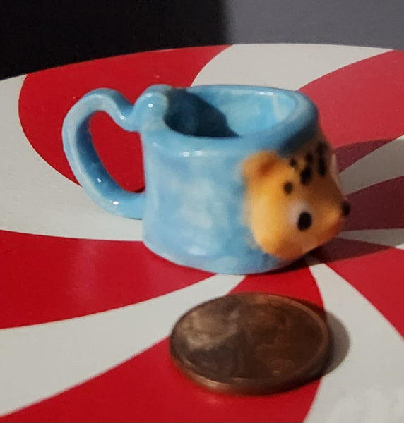 Miniature ceramic mugs, assorted animal faces