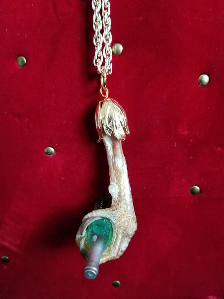 Real taxidermy chicken foot pendant with tiny riesling bottle