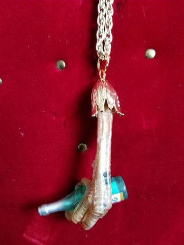 Real taxidermy chicken foot pendant with tiny riesling bottle