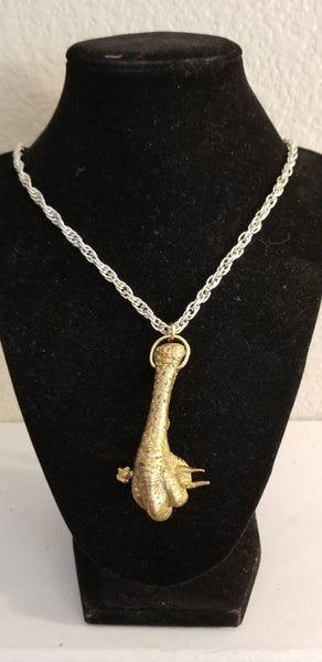 Bronze pendant of chicken foot with rubber chicken